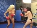 Topless female boxing as blonde battles brunette with body