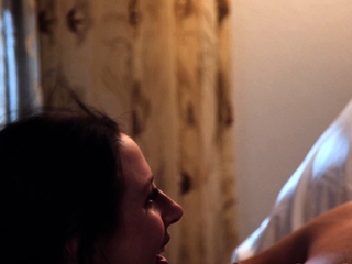 Busty curly brunette with big boobs fucks on couch